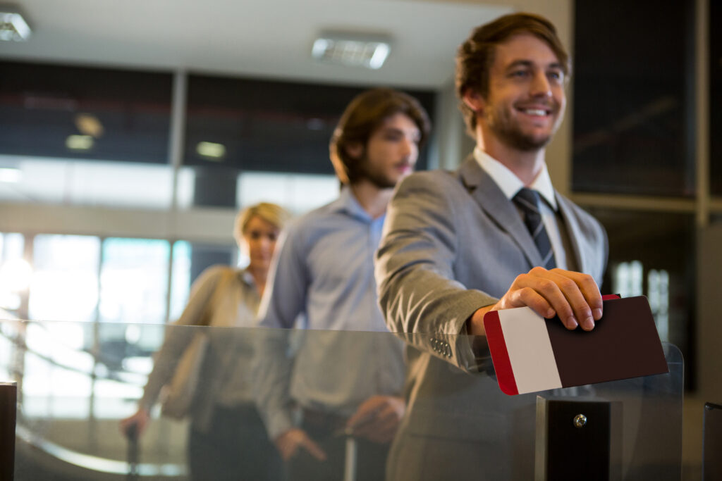 Passenger showing his visa to the personel.