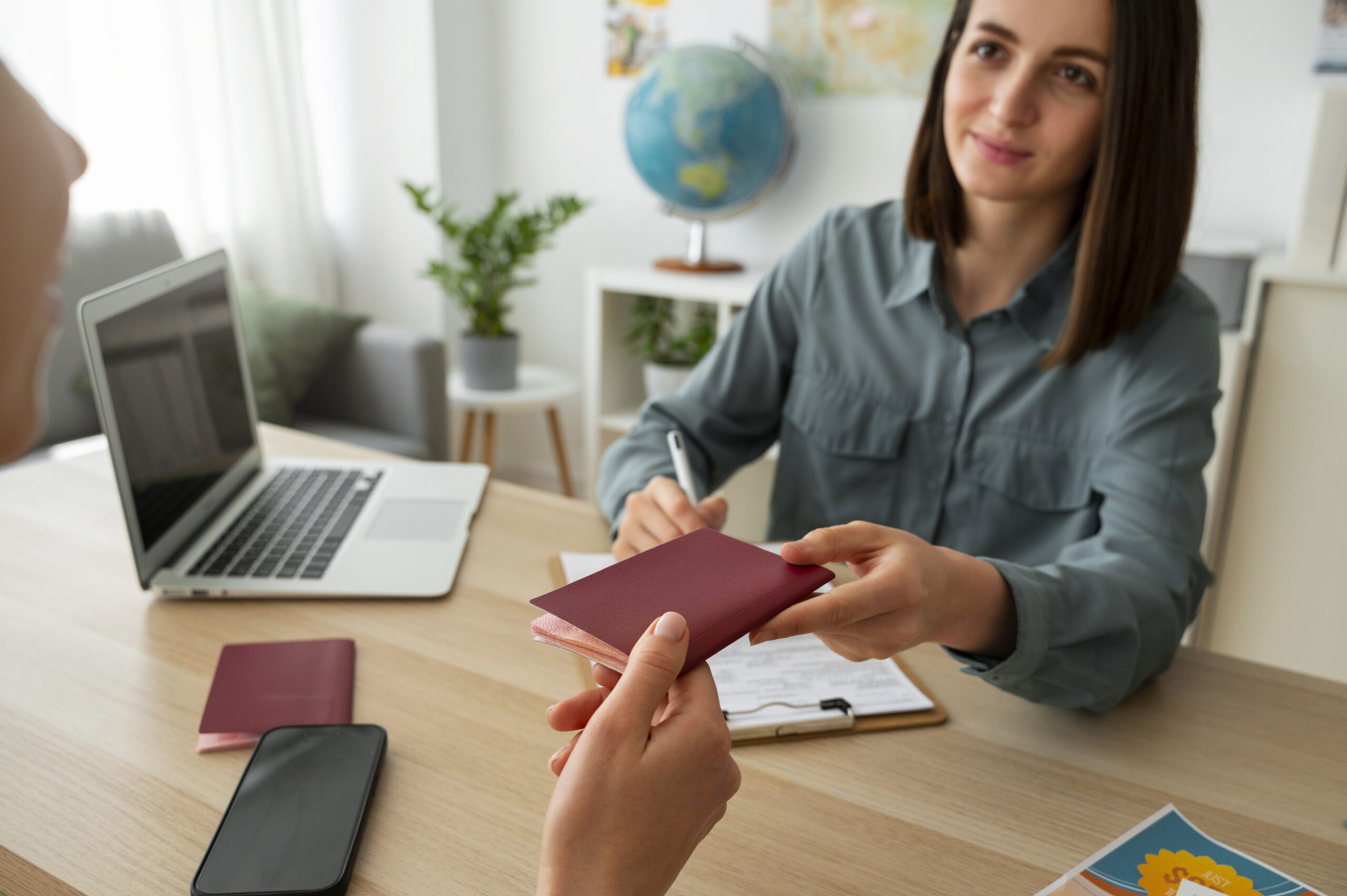 Women giving the passport and visa to the owner.