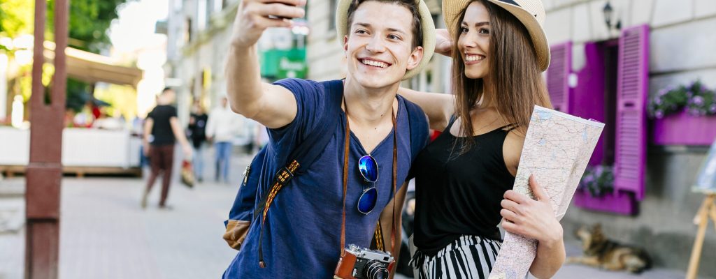 Couple taking photos after their visa got accepted.