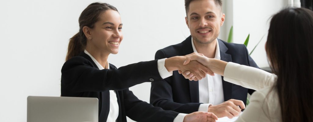 Recruitment team handshaking group of people doing the recruitment process