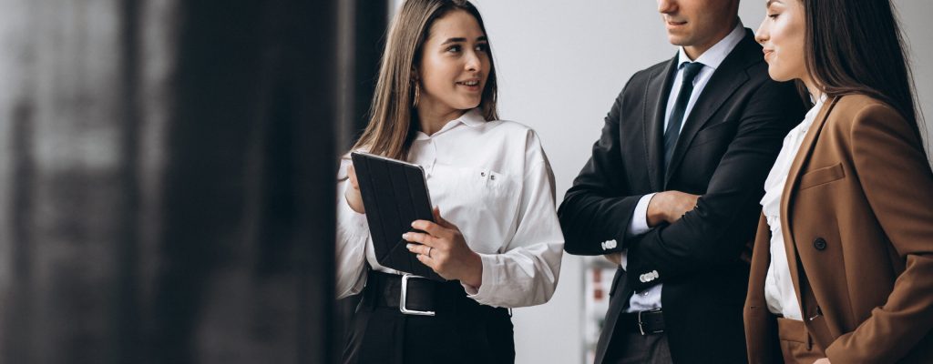 Business people working in team in an office and keeping watch of staffing trends Business people working in team in an office and keeping watch of staffing trends