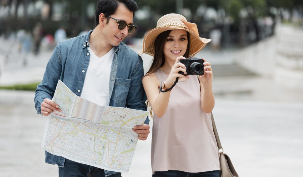 couple in the airport holding their 13A Visa.